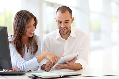 young couple reviewing ac finance options